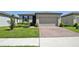 Charming single-story home featuring a brick driveway and well-maintained landscaping at 3158 Viceroy Ct, Poinciana, FL 34759