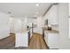 Modern kitchen showcasing granite countertops, stainless steel appliances, and white cabinetry at 3158 Viceroy Ct, Poinciana, FL 34759