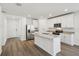 Stylish kitchen with white cabinets, stainless steel appliances, and a granite island at 3158 Viceroy Ct, Poinciana, FL 34759