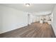 Spacious living area featuring hardwood floors and an open layout to the kitchen at 3158 Viceroy Ct, Poinciana, FL 34759