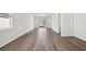 Open living space with modern hard wood floors, large windows and slider to patio at 3158 Viceroy Ct, Poinciana, FL 34759