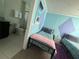 View of a bedroom with Frozen theming, including attached bathroom at 1870 Summer Dr, Davenport, FL 33897