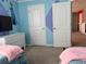Bedroom view showcasing Frozen-themed wall decor and doorways at 1870 Summer Dr, Davenport, FL 33897