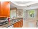 Bright kitchen featuring granite countertops, stainless steel appliances, and natural light at 524 Hockendale Cv, Sanford, FL 32771