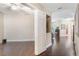 Bright living room with an open doorway, hardwood floors, and a view into the kitchen at 524 Hockendale Cv, Sanford, FL 32771