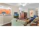 Cozy living room with wood floors and a view into the breakfast bar in the kitchen at 524 Hockendale Cv, Sanford, FL 32771