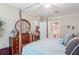 Nicely decorated main bedroom with dresser and a view into the bathroom at 524 Hockendale Cv, Sanford, FL 32771