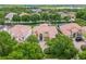 Expansive aerial view of the property showcasing a well-maintained home with a red tile roof at 334 Chadwick Dr, Davenport, FL 33837