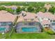 Aerial shot highlighting a screened-in pool and spa area in the backyard of the residence at 334 Chadwick Dr, Davenport, FL 33837