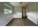 Bright bedroom features laminate floors and a large window, filling the space with natural light at 2806 Bonneville Dr, Orlando, FL 32826
