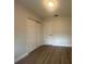 Cozy bedroom with laminate wood flooring, closet and neutral paint, perfect for rest at 2806 Bonneville Dr, Orlando, FL 32826