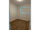 This room features hardwood floors, a window, and a light fixture at 2806 Bonneville Dr, Orlando, FL 32826