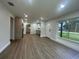 Open-concept living room and kitchen with modern finishes and plenty of natural light at 2806 Bonneville Dr, Orlando, FL 32826