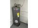 A grey Rheem water heater in a basement at 2806 Bonneville Dr, Orlando, FL 32826