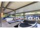 Marina view featuring boats, covered docks, and access to the open water for boating enthusiasts at 550 Saint Johns Rd, Tavares, FL 32778