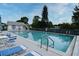 Inviting community pool with lounge chairs and well-kept surroundings on a sunny day at 550 Saint Johns Rd, Tavares, FL 32778