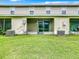 Exterior of the home showing the screened porch and green lawn at 2543 Old Kent Cir, Kissimmee, FL 34758