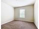 Carpeted bedroom featuring a window providing natural light at 2543 Old Kent Cir, Kissimmee, FL 34758