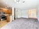 Open concept living area with kitchen, dining, and living room showcasing modern layout and abundant natural light at 2543 Old Kent Cir, Kissimmee, FL 34758