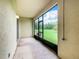 View of the screened in back porch and view of green space at 2543 Old Kent Cir, Kissimmee, FL 34758