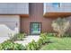 Modern front entrance with glass door and wood paneling at 10424 Pocket Ln, Orlando, FL 32836