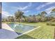 Long rectangular pool and grassy yard at 10424 Pocket Ln, Orlando, FL 32836