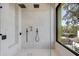 Spacious shower with double shower heads and large window at 10424 Pocket Ln, Orlando, FL 32836