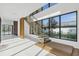 Modern floating staircase with glass railings and wood steps at 10424 Pocket Ln, Orlando, FL 32836