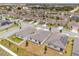 Community aerial view of single-Gathering homes with manicured lawns and mature landscaping at 531 Tortugas St, Haines City, FL 33844