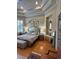 Bedroom with hardwood floors, and tray ceiling at 8734 Crestgate Cir, Orlando, FL 32819
