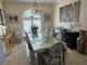 Dining room with a mirrored table, stylish chairs, artwork, chandelier and decorative accents at 8734 Crestgate Cir, Orlando, FL 32819