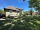 Lovely home with manicured bushes, pristine lawn, and a charming exterior at 8734 Crestgate Cir, Orlando, FL 32819