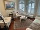 Living area showcasing a piano, seating and a large area rug with decor at 8734 Crestgate Cir, Orlando, FL 32819