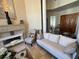 Spacious living room featuring neutral-toned furniture, a fireplace, and elegant decor at 8734 Crestgate Cir, Orlando, FL 32819