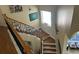 Elegant staircase with detailed iron railings and wooden steps leading to the upper level at 8734 Crestgate Cir, Orlando, FL 32819