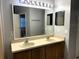 Bathroom with double vanity and mirror at 328 Chelmsford Ct, Kissimmee, FL 34758