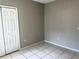 Bedroom with tile floors and closet at 328 Chelmsford Ct, Kissimmee, FL 34758