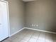 Bedroom with tile floors and closet at 328 Chelmsford Ct, Kissimmee, FL 34758