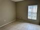 Bedroom with tile floors and window at 328 Chelmsford Ct, Kissimmee, FL 34758