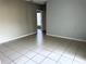 Large bedroom with tile floors and neutral walls at 328 Chelmsford Ct, Kissimmee, FL 34758