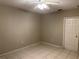 Spacious bedroom with tile floors and ceiling fan at 328 Chelmsford Ct, Kissimmee, FL 34758