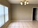 Spacious dining area with tile floors and large window at 328 Chelmsford Ct, Kissimmee, FL 34758