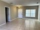 Bright living room with tile floors and neutral walls at 328 Chelmsford Ct, Kissimmee, FL 34758