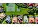 Aerial view of a neighborhood featuring a pool, tennis court, and basketball court at 9060 Heritage Bay Cir, Orlando, FL 32836
