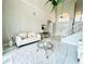 Spacious foyer with high ceilings, a white sofa, and marble floors at 9060 Heritage Bay Cir, Orlando, FL 32836