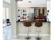 Spacious kitchen with gray cabinets, a red island, and stainless steel appliances at 9060 Heritage Bay Cir, Orlando, FL 32836