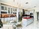 Stylish kitchen with gray cabinets, stainless steel appliances, and a red island at 9060 Heritage Bay Cir, Orlando, FL 32836
