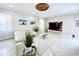 Bright living room features marble floors, modern decor, and a decorative ceiling centerpiece at 9060 Heritage Bay Cir, Orlando, FL 32836