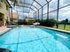 Private pool with screen enclosure features an attached spa and outdoor seating area at 9060 Heritage Bay Cir, Orlando, FL 32836