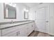 Elegant bathroom with dual sinks, granite countertops, modern lighting, and white cabinetry at 2240 Center St, Sanford, FL 32771
